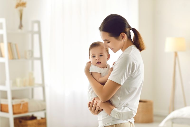 mother holding a baby